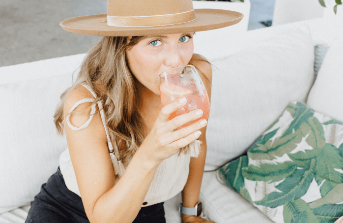 Woman Drinking Rhapsody Soda